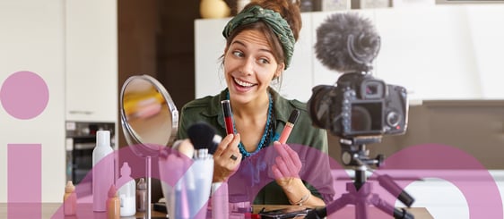 Woman comparing lipsticks on camera